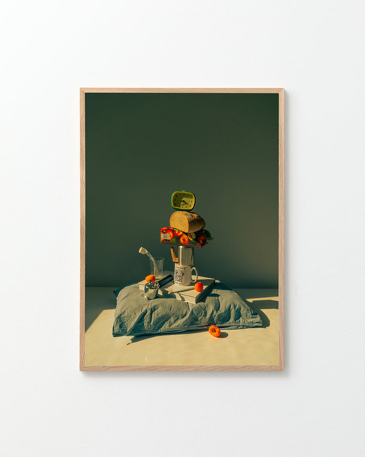 The Its Time to Wake Up Poster features a playful, surreal breakfast still life with a mug balancing a can, bread, and cherry tomatoes on a pillow. A metal watering can and more tomatoes complete the scene, making it ideal for retro photography lovers or as quirky kitchen wall decor.