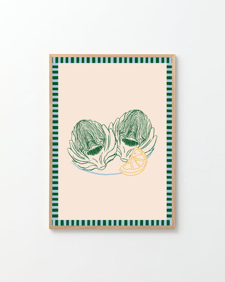 The Les Artichauts Poster has framed artwork inspired by a French market, showcasing two green artichokes and a lemon slice on beige, with stylish green and black striped borders, ideal for home decor.