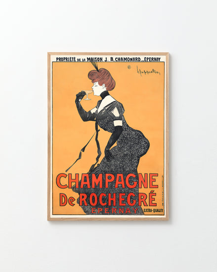 The Champagne de Rochegré Poster by Leonetto Cappiello features a woman in a black dress sipping champagne against an orange backdrop, with the text Champagne De Rochegre Epernay highlighting its origin, quality, and Art Deco elegance.