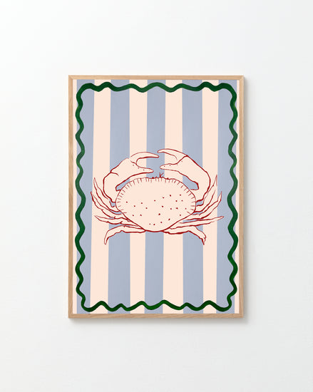 The Le Crabe Poster features a vibrant red crab on vertical blue and cream stripes, embodying a coastal vibe. A wavy green line frames the image, creating a striking effect against any plain white wall.