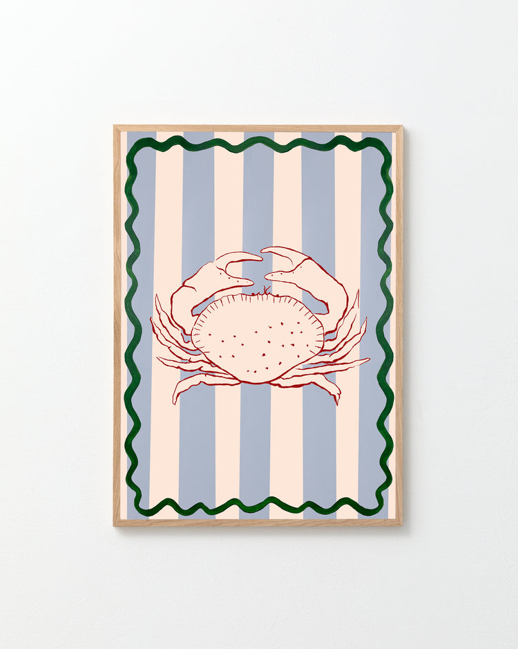 The Le Crabe Poster features a vibrant red crab on vertical blue and cream stripes, embodying a coastal vibe. A wavy green line frames the image, creating a striking effect against any plain white wall.