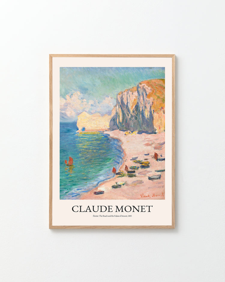 Framed Étretat: The Beach and the Falaise dAmont by Claude Monet, 1885 poster captures a French seascape with cliffs, beach, boats, and figures. Signed in red by Monet.