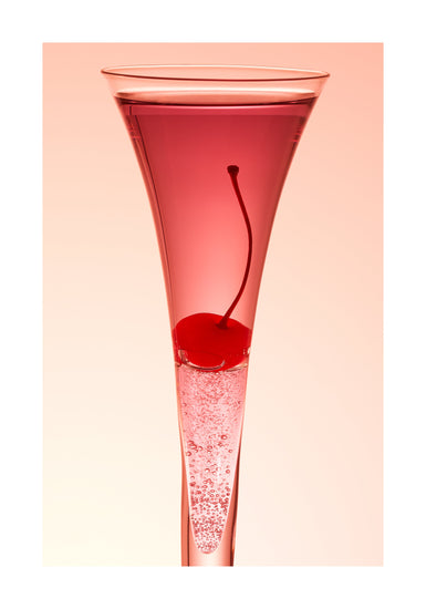 An eye-catching still life photograph showcasing a close-up of a drink adorned with a delectable cherry against a vibrant pink background. White border.