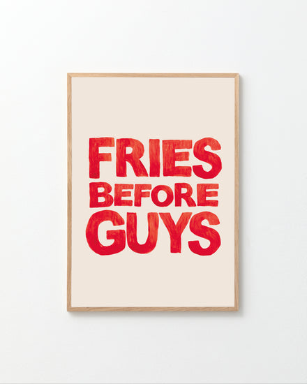 The Fries Before Guys poster is hand-painted, featuring bold red letters on a light beige background.