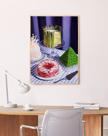 Poster "Dessert Group" in oak frame above a desk