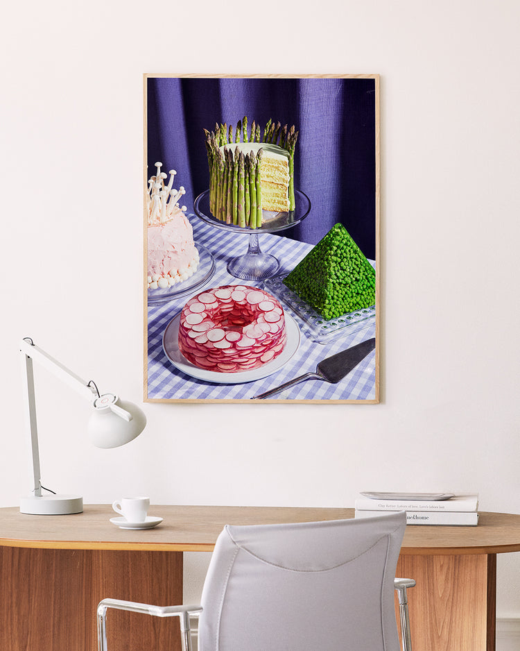 Poster "Dessert Group" in oak frame above a desk