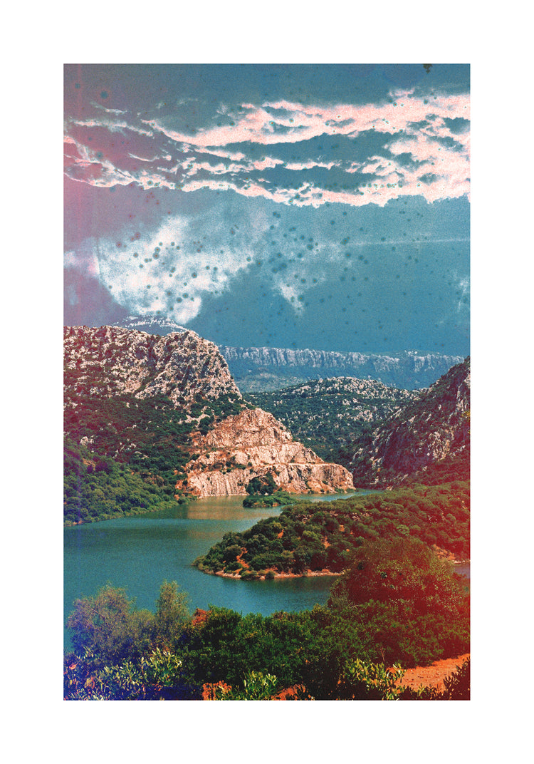 Canyon scenery with mountains covered in lush green forest and a blue river.