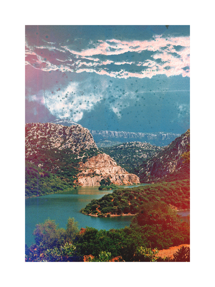 Canyon scenery with mountains covered in lush green forest and a blue river.