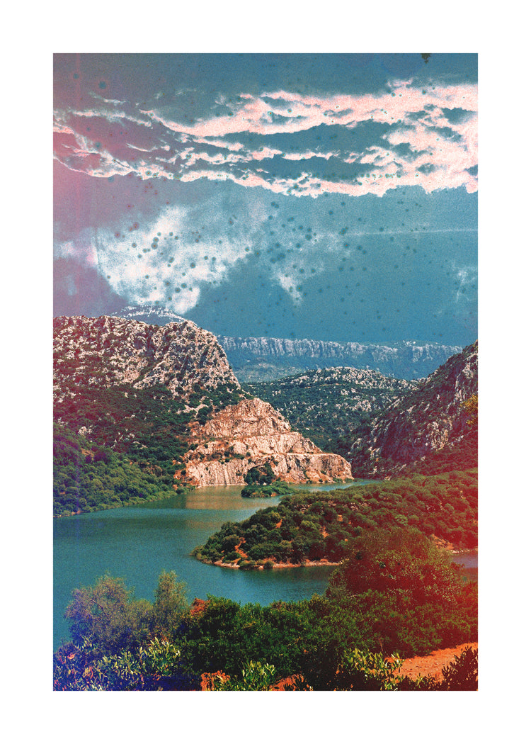 Canyon scenery with mountains covered in lush green forest and a blue river.