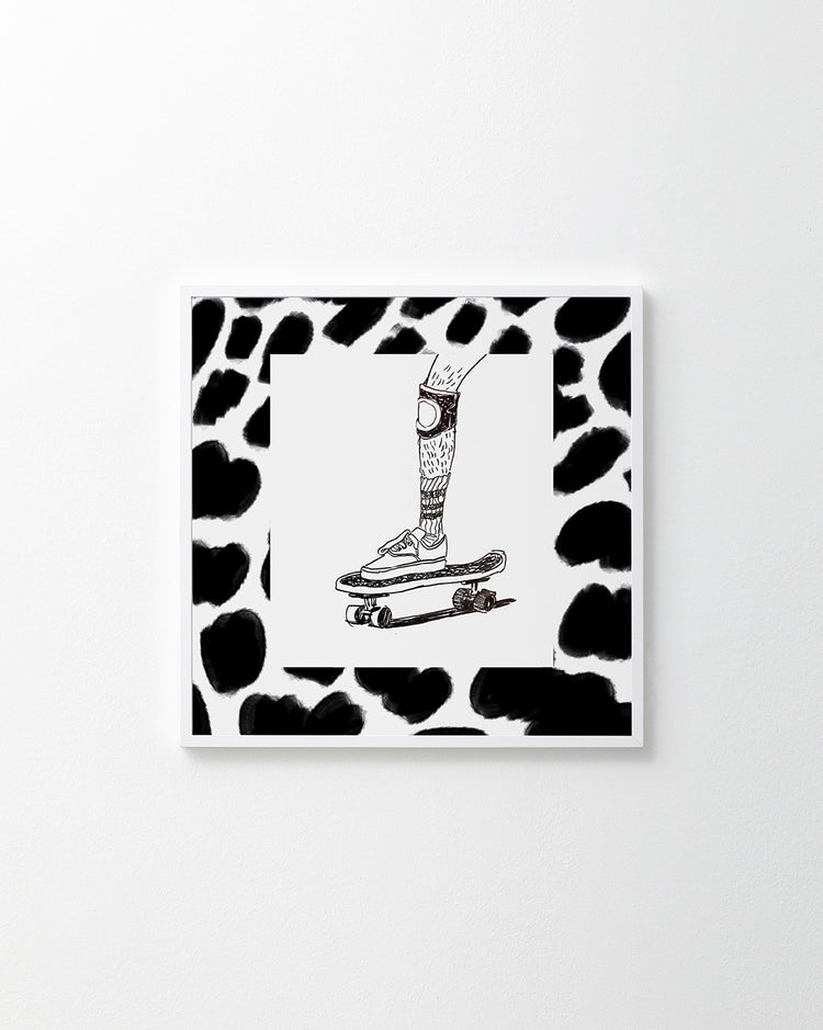 Skater wearing Vans and a kneepad framed in a black and white pattern.