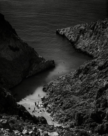 Small, secret beach squeezed between huge mountains.