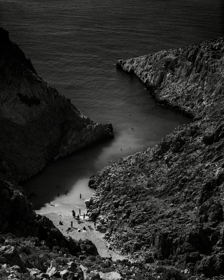 Small, secret beach squeezed between huge mountains.