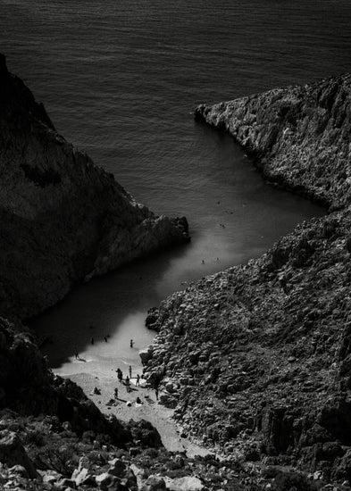 Small, secret beach squeezed between huge mountains.