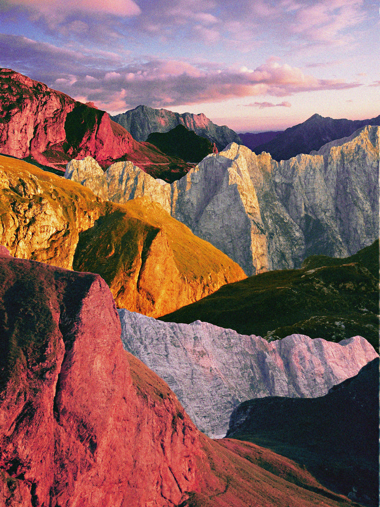 A cross between photograph and painting depicting a colorful mountain scenery.