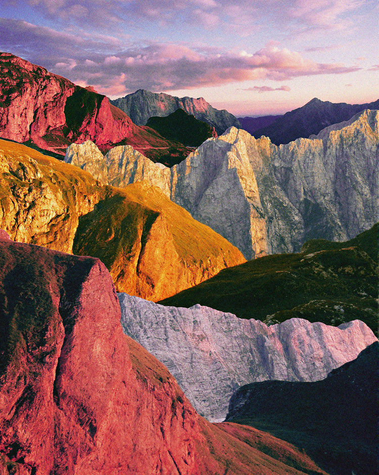 A cross between photograph and painting depicting a colorful mountain scenery.