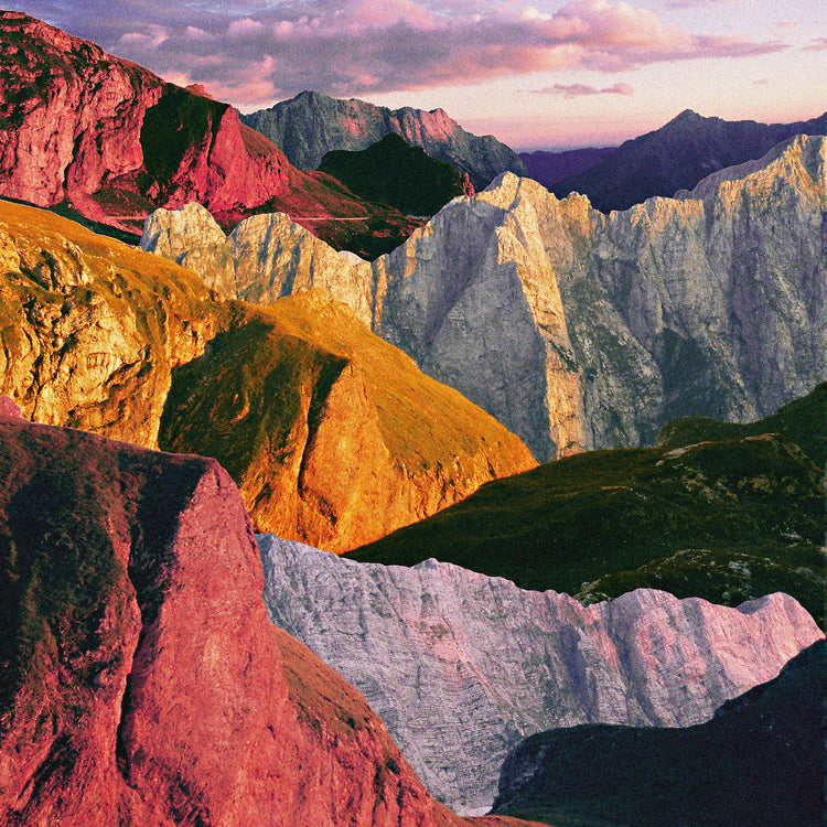 A cross between photograph and painting depicting a colorful mountain scenery.