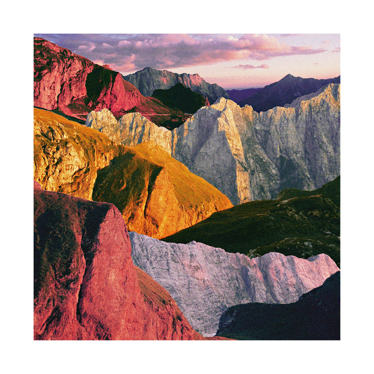 A cross between photograph and painting depicting a colorful mountain scenery.