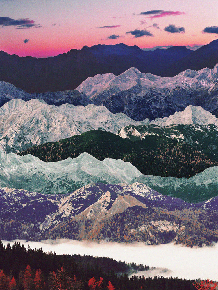 Colorful mountain scenery with a pink sky and a forest set in a valley below.