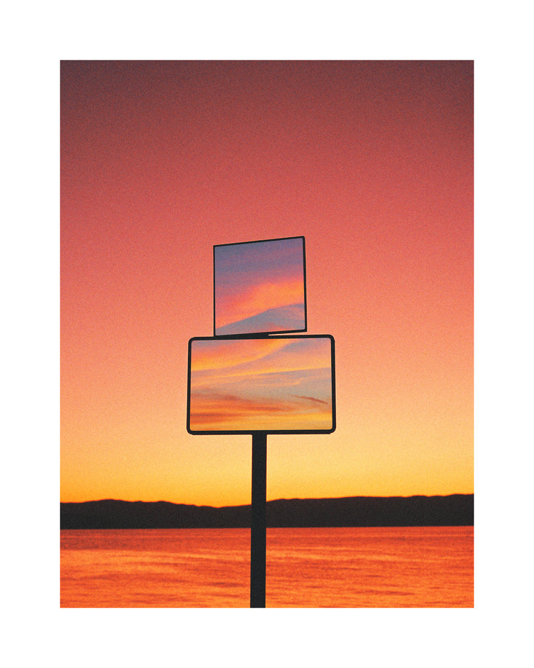 Mirrors reflecting a sunset scenery with sea and sky colored in orange and pink.