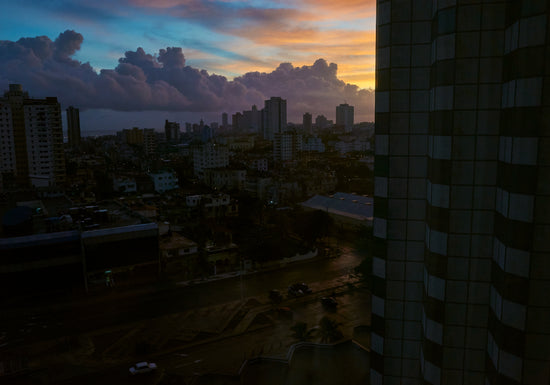 The Cuban capital Havana viewed from above under a sunset sky.