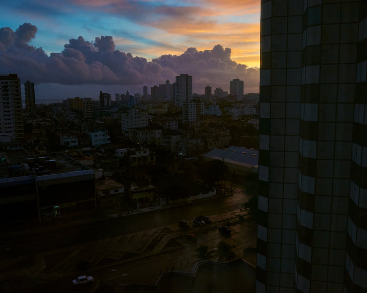 The Cuban capital Havana viewed from above under a sunset sky.