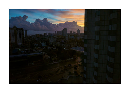 The Cuban capital Havana viewed from above under a sunset sky.