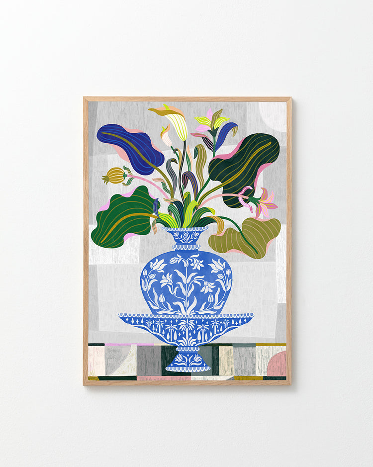 The Vase Poster features a framed floral arrangement in a blue and white decorative vase, echoing Swedish Kurbits style. The flowers vary in shape and color, surrounded by green leaves and pink blossoms against abstract gray and white patterns.