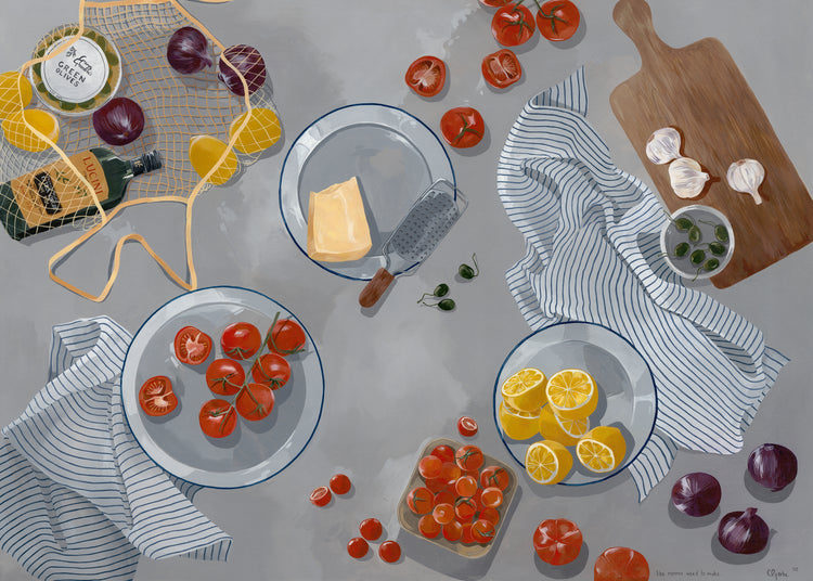 Aerial view of three plates on a gray surface showcasing fresh tomatoes, vibrant lemons, and cheese with a grater. The cozy kitchen scene is enhanced with striped cloths, garlic, onions, a wooden board, and a net bag containing wine and juice—captured in the Like Nonna Used to Make Poster.