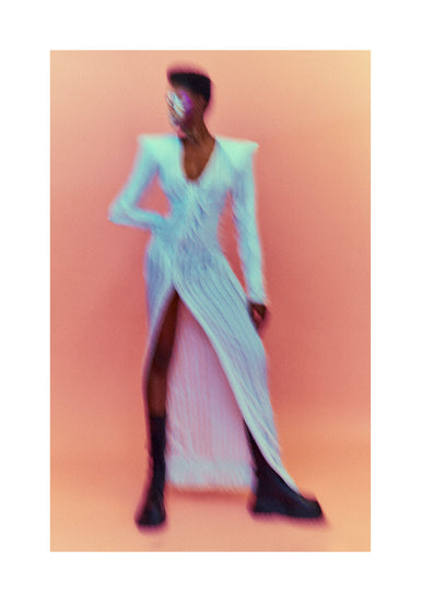 A blurry poster of a woman in a white dress in front of a peach pink background.