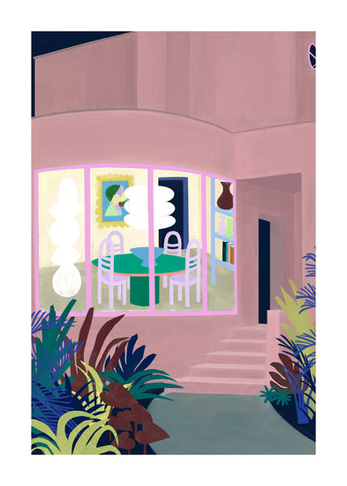 The Lighted Windows 01 Poster depicts a modern house with a large window showing a dining area featuring a round table, chairs, vibrant artwork, and shelves. Outside, lush plants line the path leading to steps at the corner of this picture-perfect home.