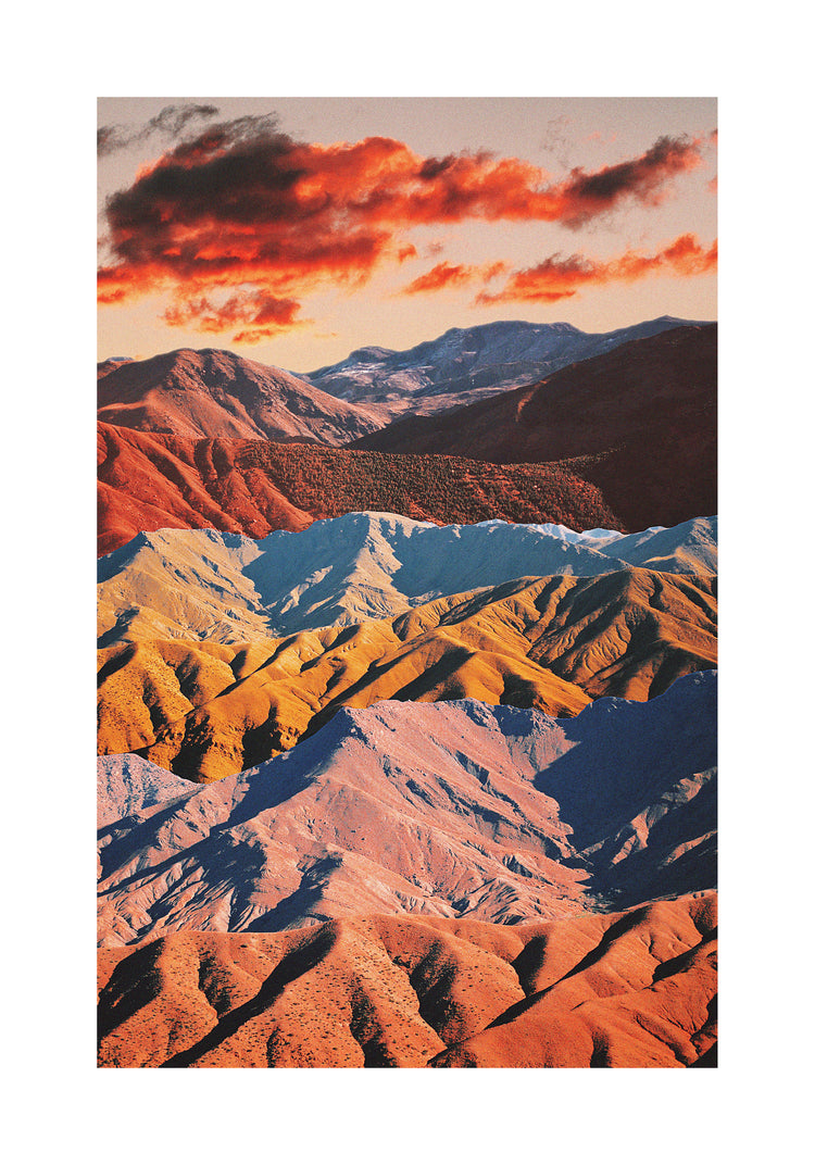 Mountain ranges in different colors creating natural lines in a barren landscape.