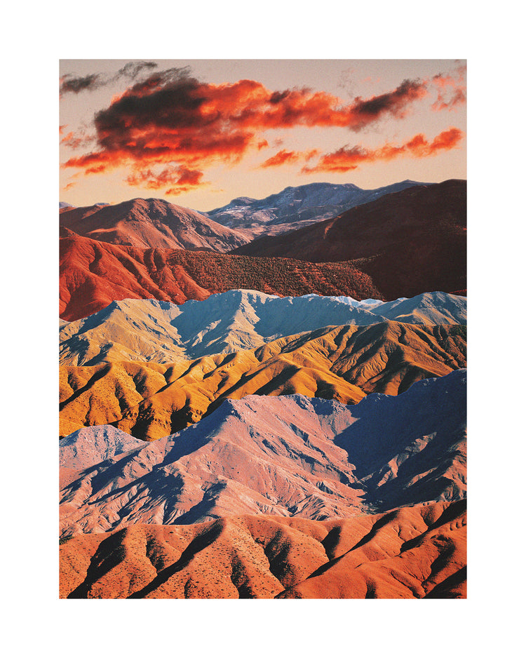 Mountain ranges in different colors creating natural lines in a barren landscape.