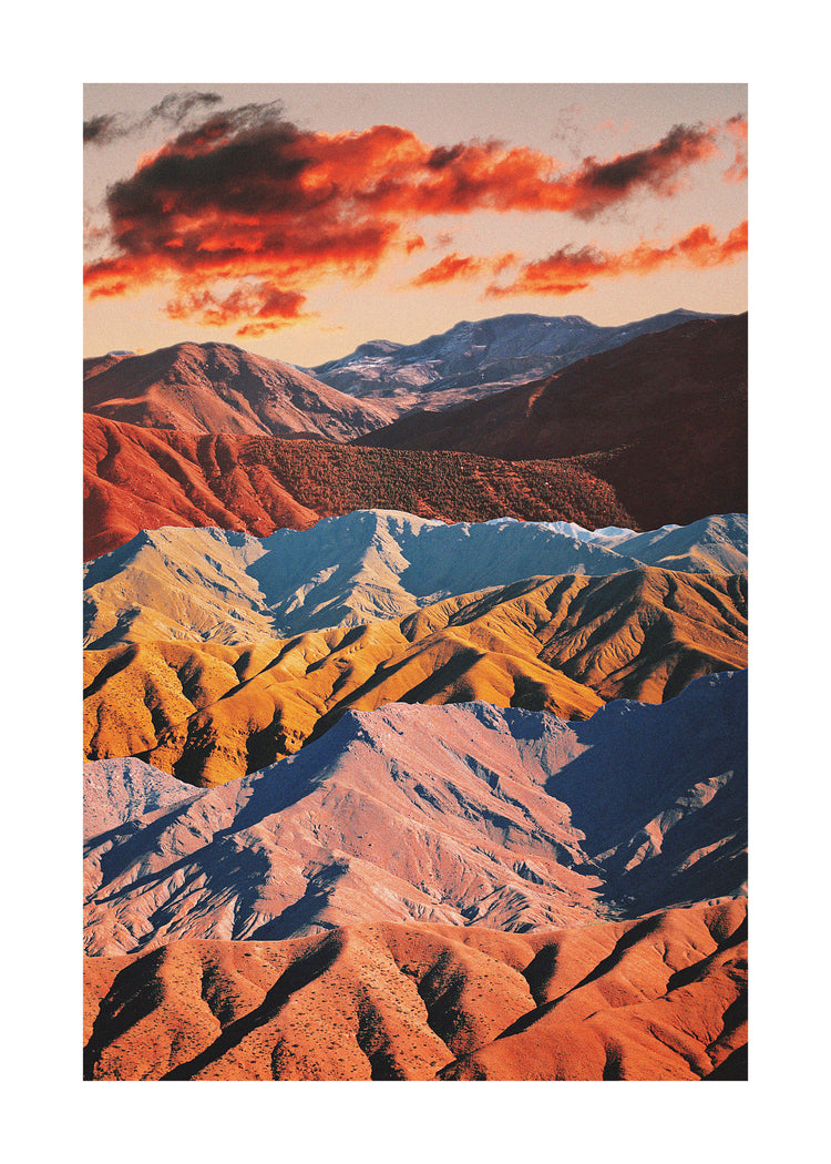 Mountain ranges in different colors creating natural lines in a barren landscape.