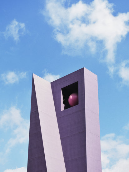 Featuring a modern, angular purple design with a square window near the top housing a large pink sphere, the Pershing Square Tower Poster evokes Hanna KLs style and contrasts beautifully against a clear blue sky dotted with white clouds.