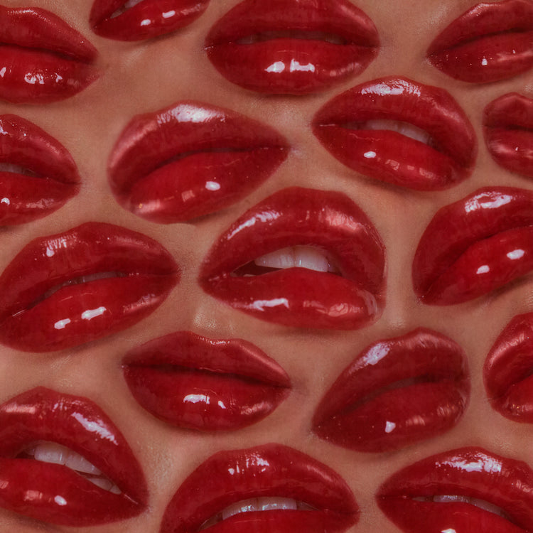 A pattern made from a bunch of shiny red lips.