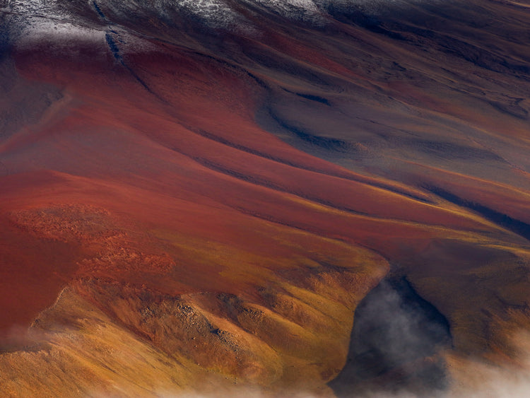 Mountain scenery full of minerals looking like a crater on mars.