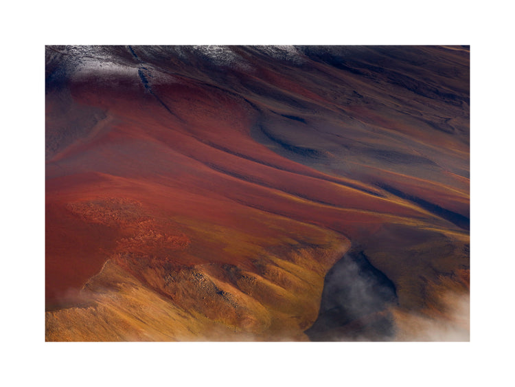 Mountain scenery full of minerals looking like a crater on mars.