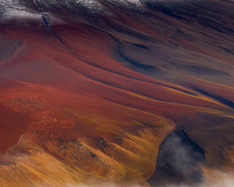 Mountain scenery full of minerals looking like a crater on mars.