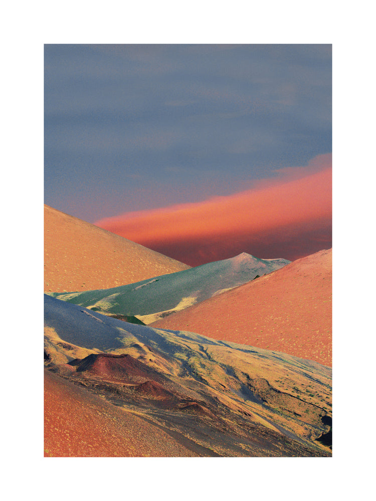 Colorful mountain scenery sparkling under a blue sky with crimson clouds.