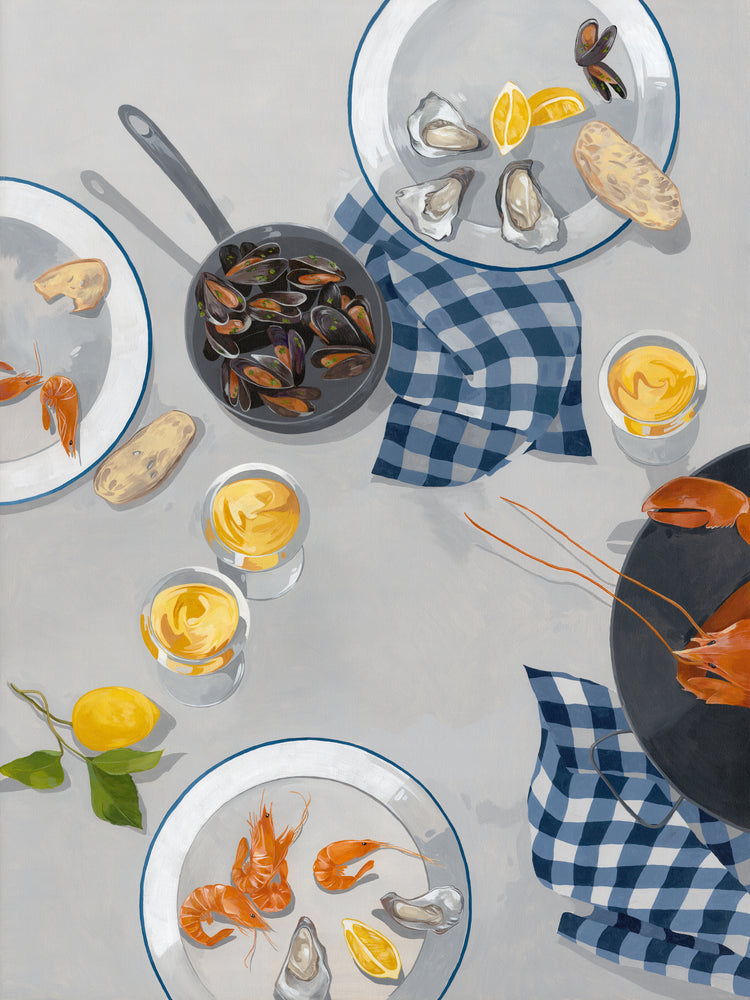 Plates and bowls brimming with shrimp, oysters, and mussels grace the table with blue checkered napkins. Glasses of yellow liquid, lemon wedges, and crusty bread complete the scene. A vintage Break Out of the Shell I poster subtly complements the maritime feast.