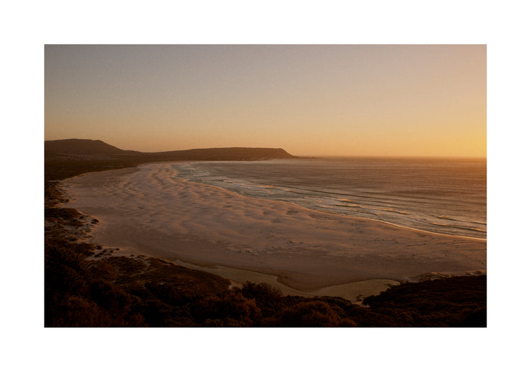 Shoreline during low tide captured at sunset.