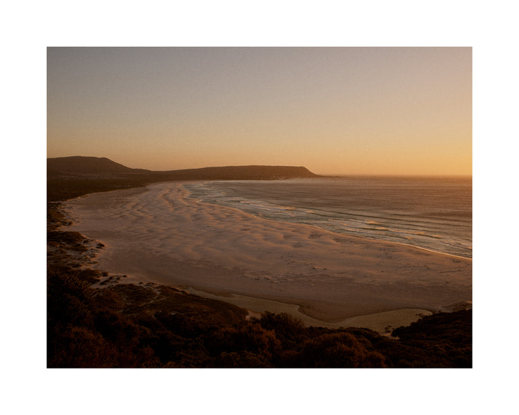 Shoreline during low tide captured at sunset.