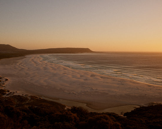 Shoreline during low tide captured at sunset.