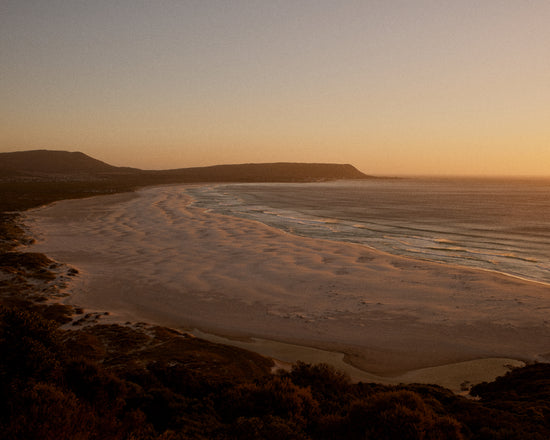Shoreline during low tide captured at sunset.
