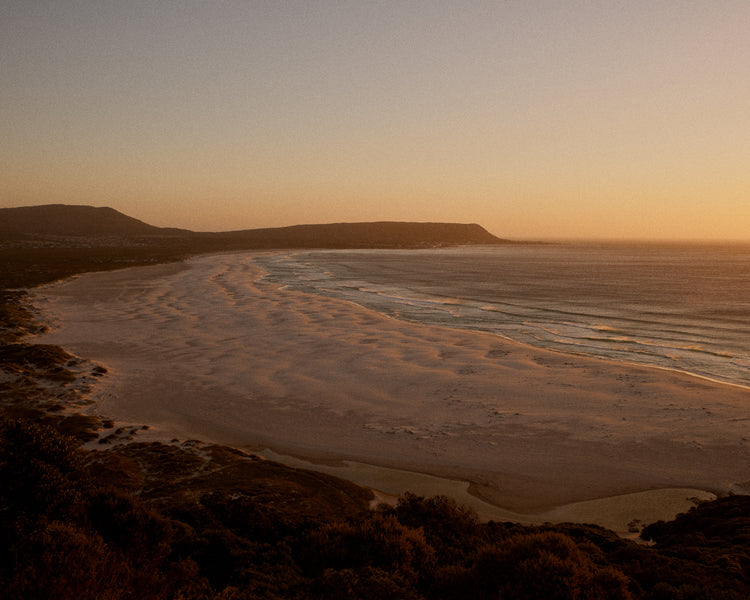Shoreline during low tide captured at sunset.