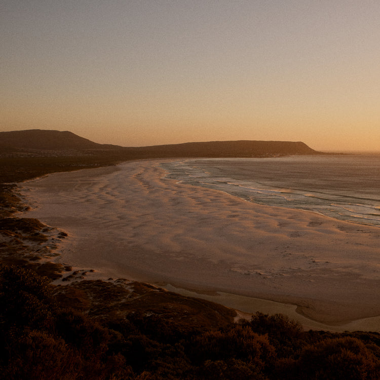 Shoreline during low tide captured at sunset.