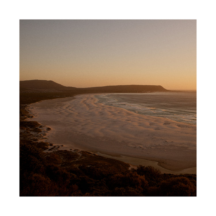 Shoreline during low tide captured at sunset.