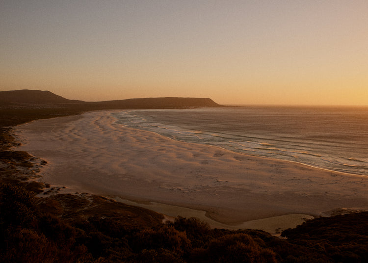 Shoreline during low tide captured at sunset.