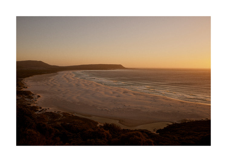 Shoreline during low tide captured at sunset.