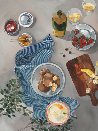 The Breakfast of Champions Poster depicts a breakfast spread with illustrated fluffy pancakes topped with bananas, strawberries, and cherries. Nearby are sliced fruit on a cutting board, yogurt, jam jars, drinks with lemon slices, honey bottles, and a striped cloth for an inviting morning table.